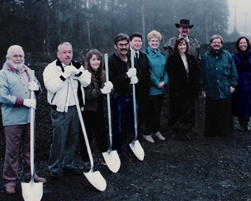 KANA team photo holding shovels